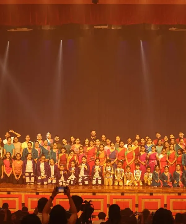 The grand finale of SparkLights, with all 120+ students and faculty gathered on stage at the Chowdaiah Memorial Hall. This image captures the immense scale and celebratory spirit of our annual showcase.