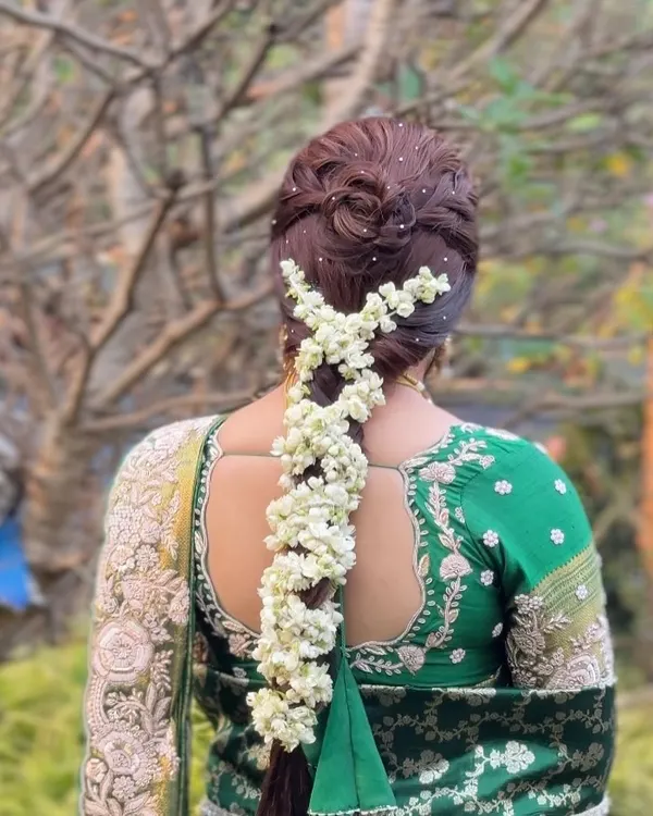 This is the hairstyle I love creating the most. A traditional South Indian braid, intricately woven and adorned with fresh jasmine gajra, perfect for a classic bridal look. The detailed craftsmanship ensures the style holds beautifully throughout the wedding ceremonies.