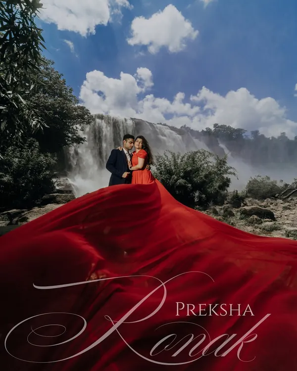 Against the raw power of a cascading waterfall, we captured this couple's love story, using a flowing red gown to create a dramatic, cinematic moment that feels both grand and deeply personal.