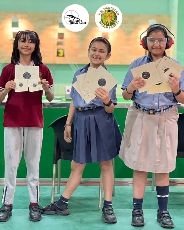 Students from K.R. Mangalam World School proudly display their targets. We help kickstart shooting careers with structured school programs.