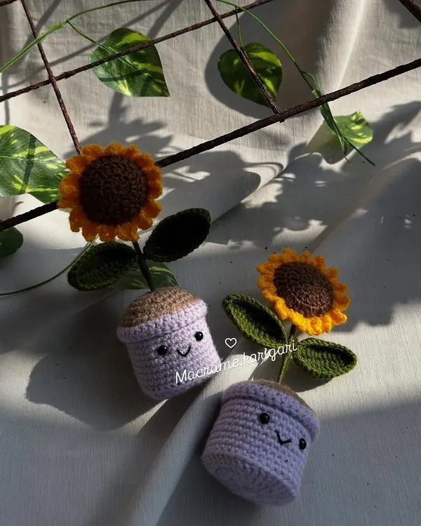 Brighten up your desk or shelf with our adorable crochet sunflower mini pots. Each pot has a cute smiling face, and the sunflower is crafted with vibrant yellow yarn. They are a perfect, low-maintenance way to add some cheer to your space.