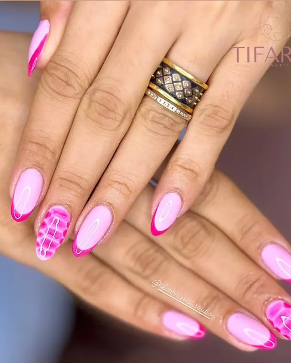 Pretty in pink. A bold and elegant set combining pink French tips with a striking pink crocodile-print accent nail.