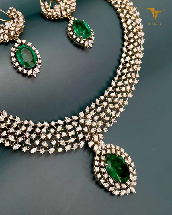 For those who embrace elegance at every turn, this prong-set diamond and emerald necklace radiates sophistication. The marquise-cut diamonds create a beautiful texture, perfect for understated luxury.