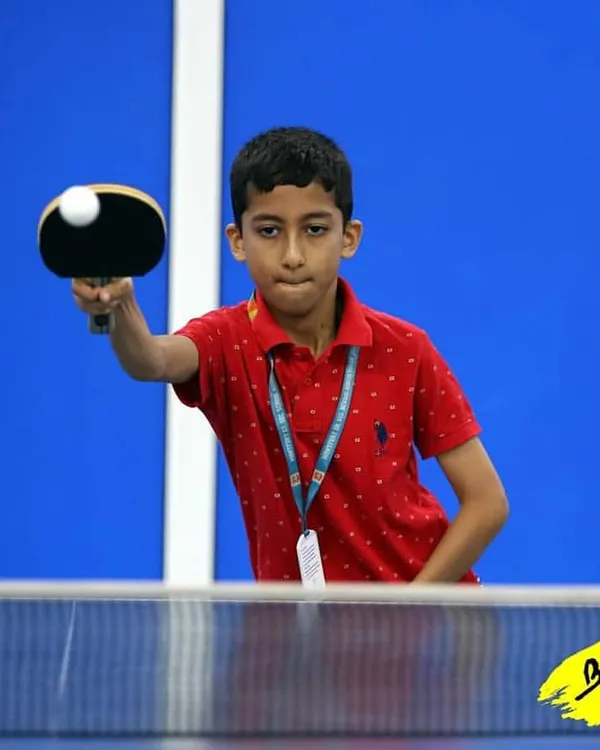 This is the focus I teach. Here, one of my young players is locked in during a competitive match, tracking the ball and preparing his return. Every point matters.