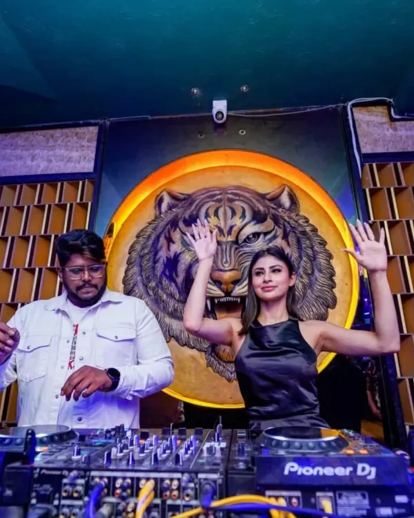 I bring the energy to every event, whether it's a club night or a special appearance with stars like Mouni Roy. Here I am, live on the decks, creating a vibe that gets everyone moving.