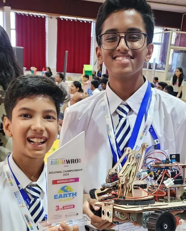 This is what it's all about! The pride on our students' faces after winning third place at the World Robot Olympiad regionals. They built this incredible robotic arm, competed hard, and earned their spot at the nationals.