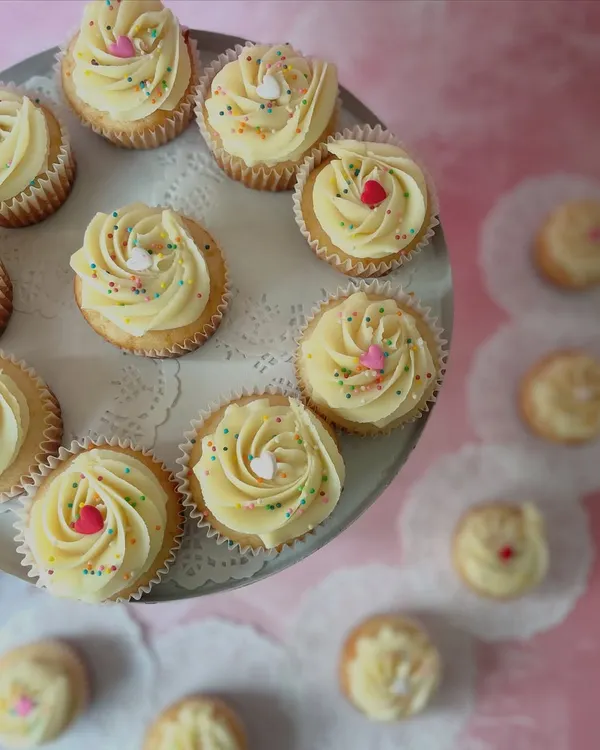 Sometimes, simple is best. Our classic vanilla cupcakes are topped with a light, creamy frosting and colorful sprinkles, perfect for any sweet craving.