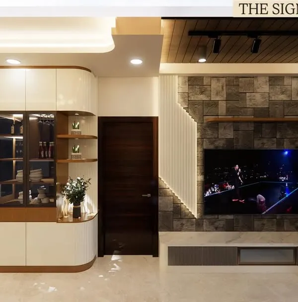 This living area at Prestige Waterford was designed for connection and comfort. I combined a stone-clad TV wall with warm veneer finishes and layered lighting to create an inviting atmosphere for a family of five.