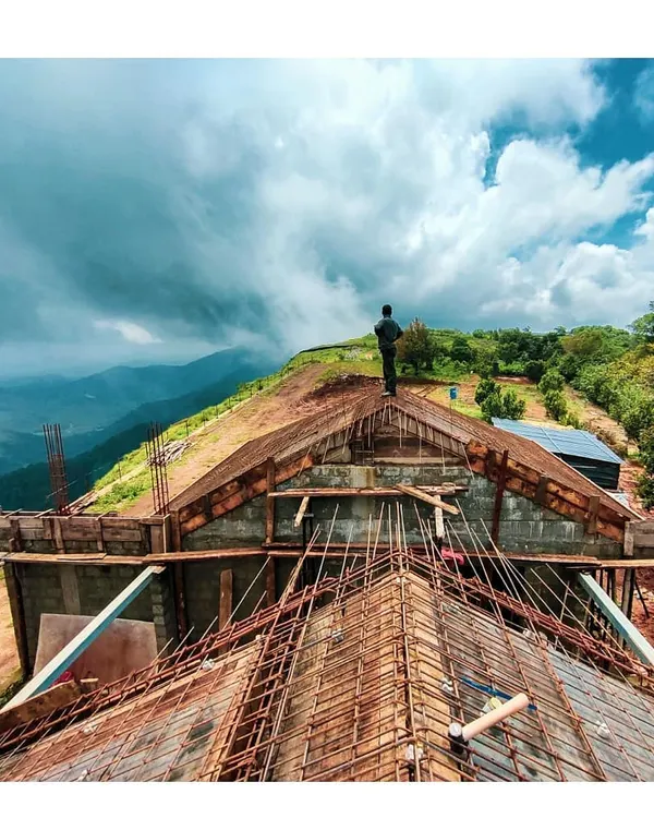 Overlooking the dramatic landscape from the roof of our Vagamon resort project during construction. This image embodies my commitment to being on-site, making critical design decisions that honor the spirit and scale of the location.