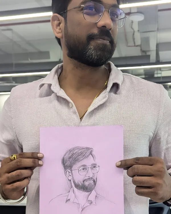 A happy client holding his freshly sketched portrait at the office. I enjoy doing these quick, live sketches to capture people in their natural environment.