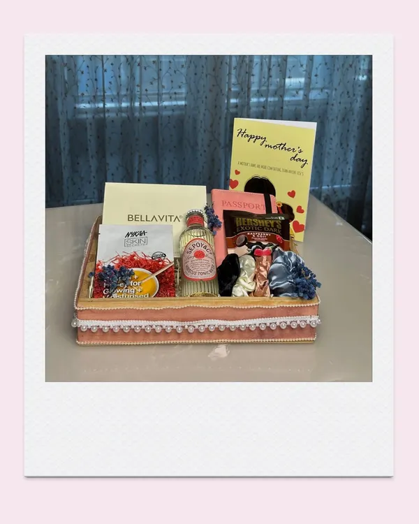 A Mother's Day hamper designed to be as elegant and graceful as she is. This one includes perfume, chocolates, and other treats in a beautifully decorated tray.