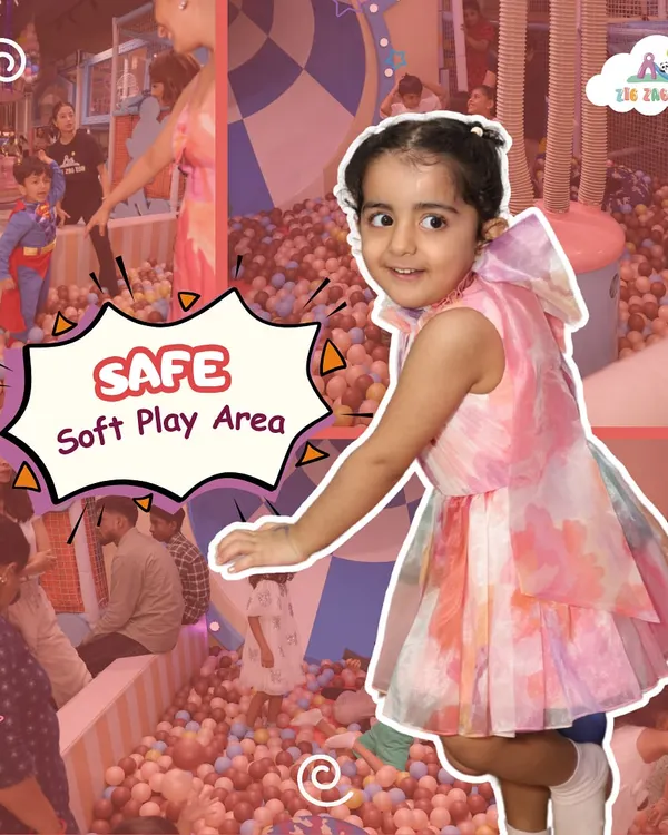 Our safe, soft play area is perfect for little ones to explore and have fun! This little girl is having a blast in our giant ball pit, a favorite spot for kids of all ages.