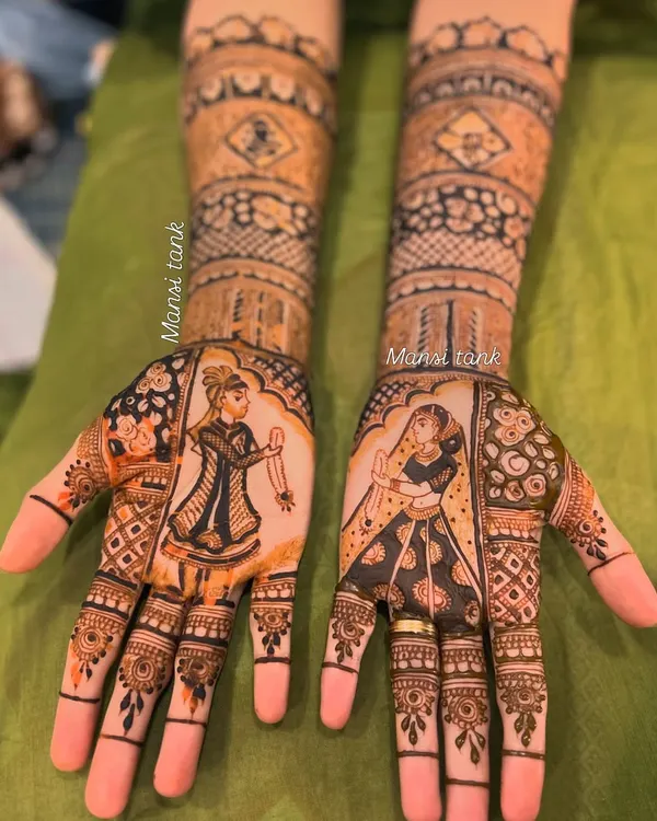 This full bridal mehendi shows how we can tell a story on both hands. I love creating these detailed bride and groom figures, surrounded by intricate traditional patterns.