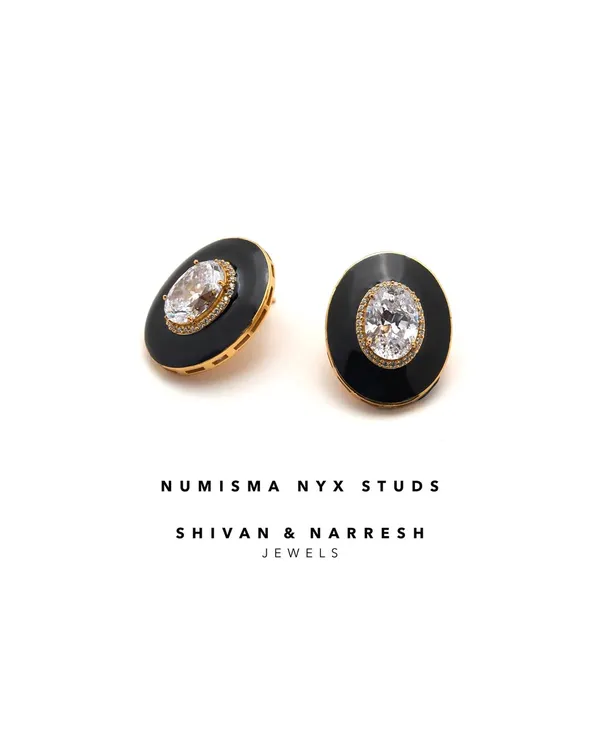 The Numisma Nyx Studs are understated yet unforgettable. These versatile studs, with their black enamel and central crystal, are a modern ode to minimal luxury, perfect for everyday wear or a special occasion.