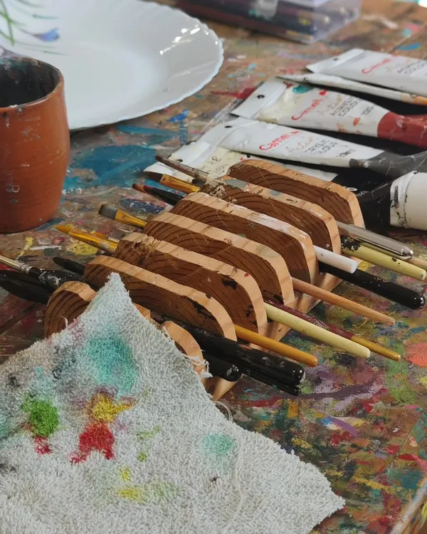 Paint-spattered tables and brushes that feel like an extension of our hands. This is our happy place, where we sit down to create and the world shifts.
