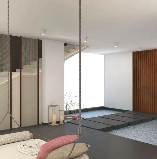 The entrance is the first impression of your home. In Indian culture, it's a sacred threshold. This design creates a tranquil welcome with an indoor water body, stepping stones, and a swing, setting a peaceful tone for the entire house.