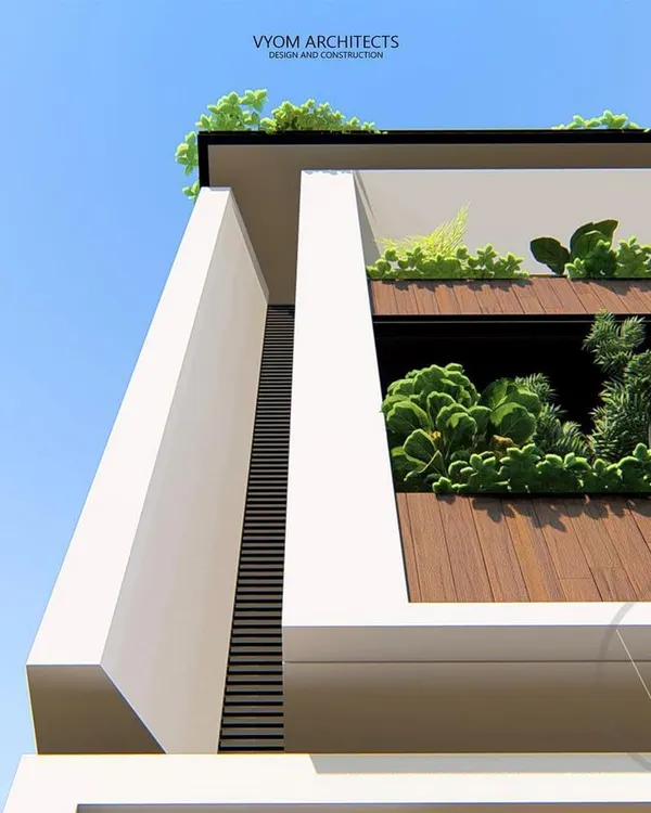 A detail shot of the Dasharatha residence, highlighting the integration of green planters into the balcony design. This adds a touch of nature and softness to the modern architectural lines.