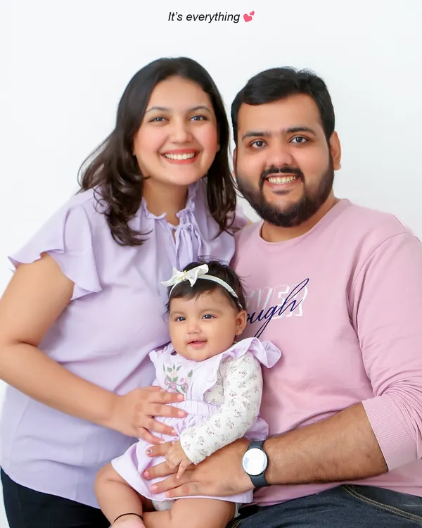 This is the heart of what I do: capturing the pure happiness of a family together. This classic studio portrait focuses on the bright, genuine smiles and the easy connection between parents and their child, creating a timeless memory.