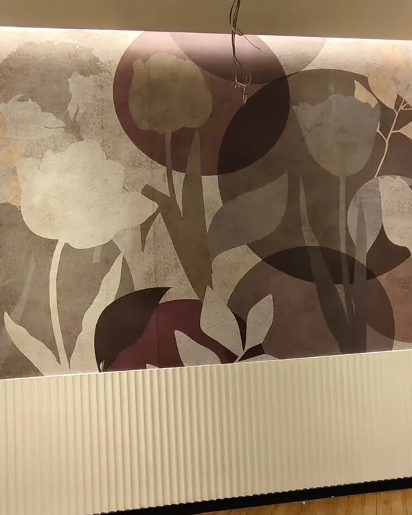 A modern, large-scale floral mural installed above white wainscoting in Palghar. The abstract tulips and moody color palette create a sophisticated and artistic look.