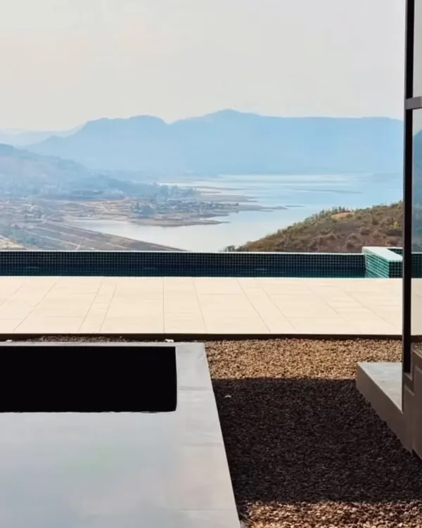 This infinity pool overlooking the Pawna lake exemplifies our philosophy of creating architecture that harmonizes with its landscape. We design homes as serene retreats, where the boundary between the built environment and nature dissolves, offering moments of profound tranquility.