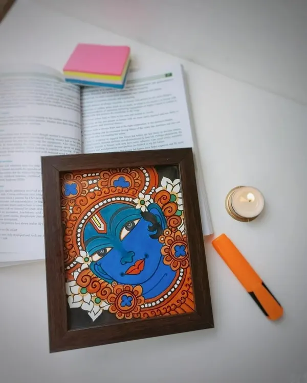 This 9x10 inch framed Narayana painting is shown on a desk, adding a touch of divinity to a workspace. It’s a perfect example of how a small piece of art can bring so much peace.