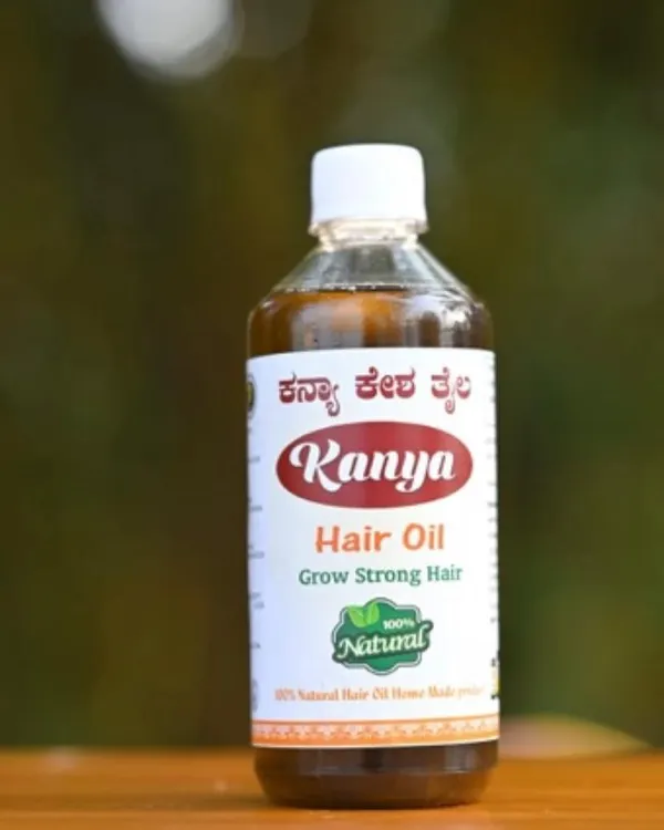 A simple, clean shot of a bottle of my Kanya Hair Oil. The label clearly states "100% Natural Hair Oil Home Made product".