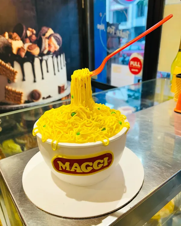 Yes, this is a cake! I had so much fun creating this hyper-realistic Maggi bowl cake for a true noodle lover's birthday. Every detail, from the floating fork to the individual noodles and garnishes, is completely edible and 100% vegetarian.