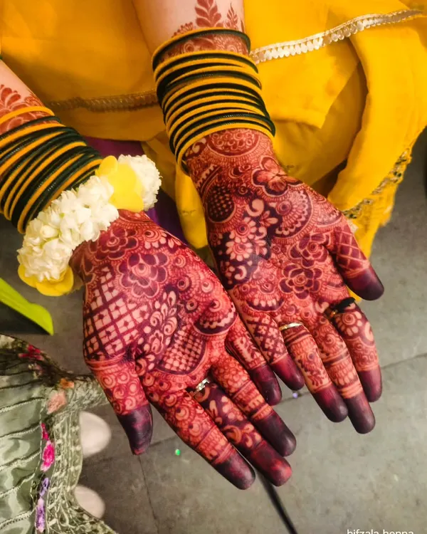 This is the result everyone dreams of. A deep, rich mehendi stain that looks absolutely stunning for any celebration, paired with beautiful bangles to complete the look.