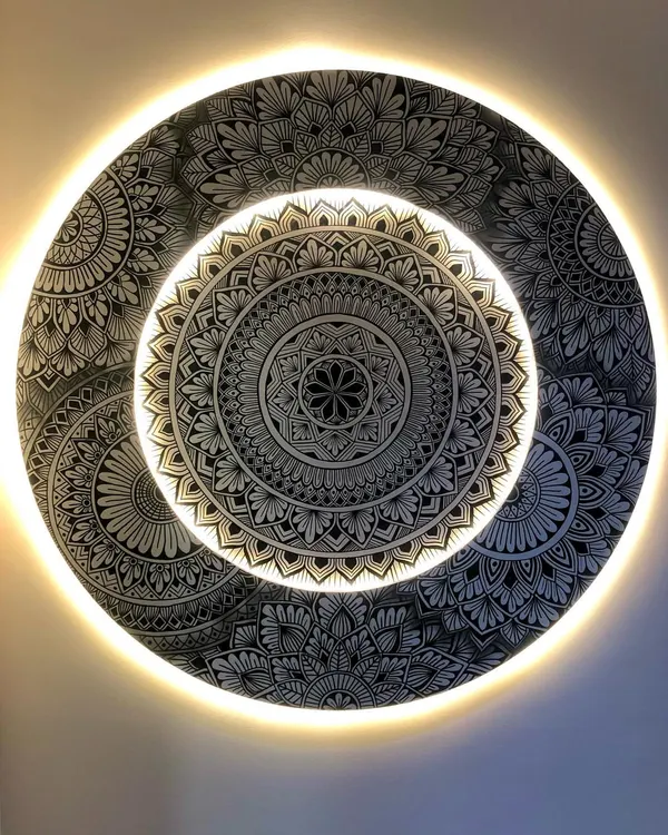 The final look of the layered and backlit mandala. The warm light creates a halo effect, highlighting the intricate details and making the artwork float off the wall.