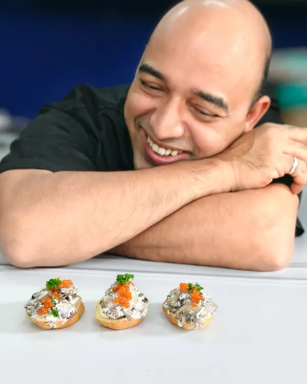 Pure joy is watching your creation come to life. My smile says it all as I admire the indulgent truffle mushroom crostini. Culinary passion served with happiness.