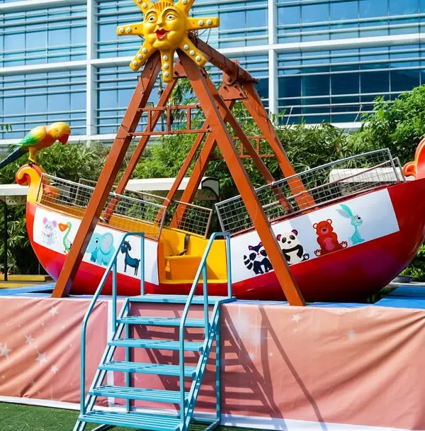 A classic swinging pirate ship ride that provides gentle thrills for younger party guests, perfect for an outdoor carnival or adventure-themed birthday.