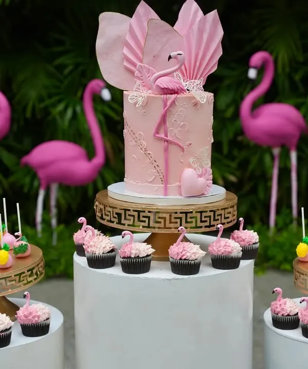 This Flamingo Paradise dessert table was a joy to create. The setup features a custom pink buttercream cake with a wafer paper fan, surrounded by matching flamingo cakepops and themed cupcakes, making it the perfect tropical centerpiece for a birthday party.