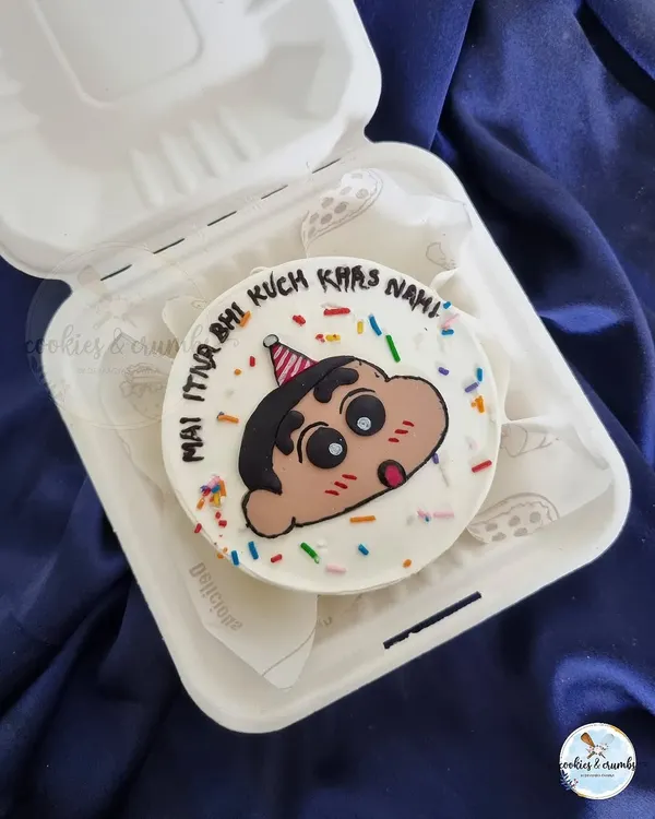 A cute Shinchan bento cake. These little lunchbox cakes are perfect for adding a personal and fun touch to any celebration.