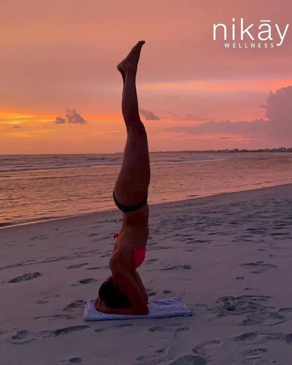 This is what it's all about. Finding your strength, your balance, and your peace, wherever you are. This student's journey to a strong, confident headstand on the beach captures the transformative power of a consistent practice.