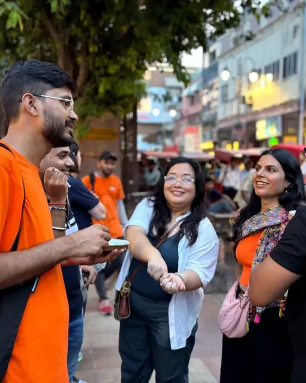 This is where food and stories come together. Our guide shares tales of Chandni Chowk with a group of explorers, proving that a shared meal is the best way to connect with a city's culture and its people.