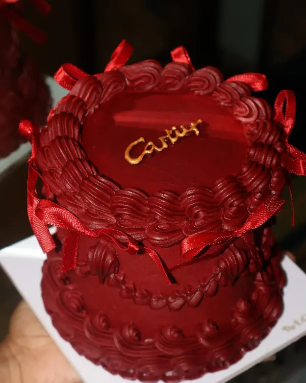 She said Cartier, so we made it cake. This rich, red vintage-style cake is inspired by the iconic jewelry box, complete with the Cartier logo in gold.