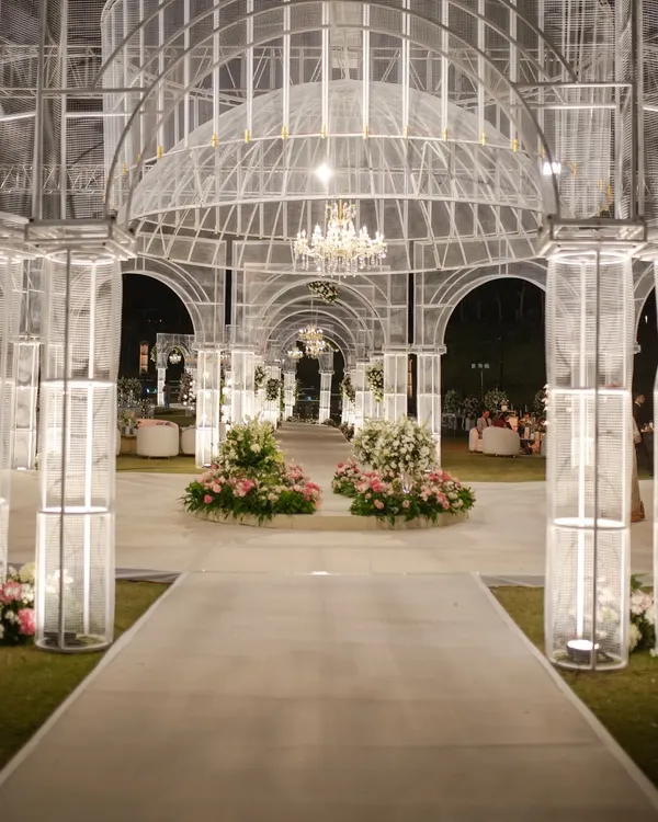 This is what I mean when I say decor should be the main character. We built this entire ethereal structure from wire mesh, creating a modern-day palace under the stars. It's giving architectural dream, it's giving unforgettable.