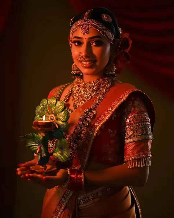 Wishing everyone a happy Diwali with this beautiful look. The model is wearing a stunning matha patti and choker set, perfect for the festival of lights.