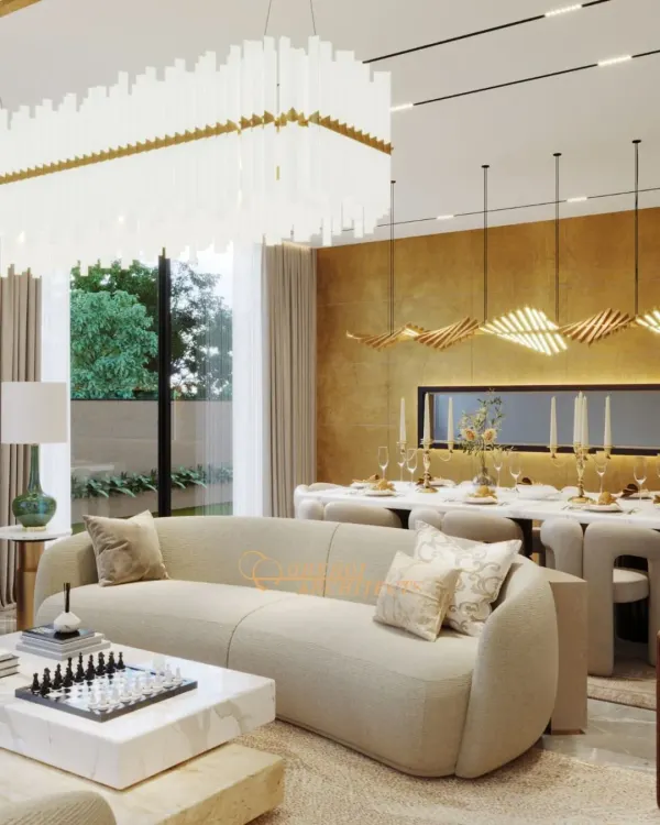 A composition of understated luxury, where sculpted seating and layered textures create an atmosphere for calm conversations and refined living. This open-plan space is unified by a palette of warm neutrals and statement lighting that doubles as art.