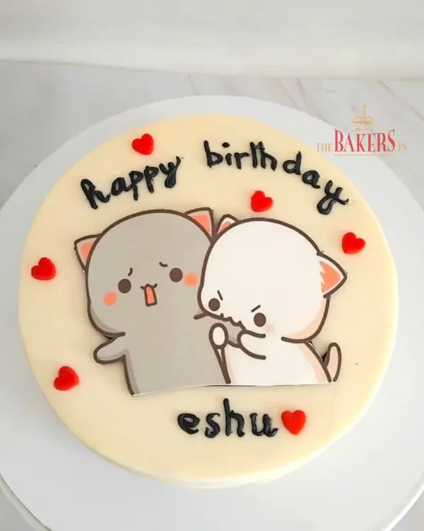 A cute and simple birthday cake for Eshu. This no-fondant cake features an adorable hand-painted illustration of the "Peach and Goma" cats, perfect for celebrating with your favorite person.