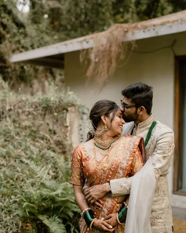 A tender moment captured in a lush, natural setting. We find those perfect, quiet spots at your venue for romantic portraits away from the crowds.