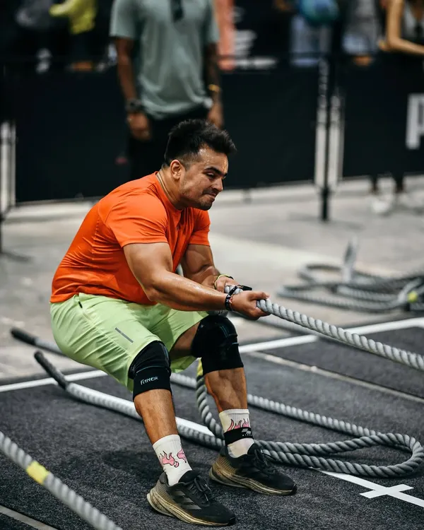 The sled pull is a beast. Here I am at Hyrox Mumbai, focusing on technique to move 153kgs efficiently. It's all about using your body weight and maintaining a strong posture.