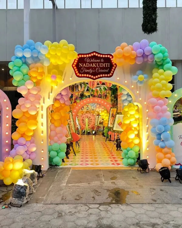 I design immersive grand entrances that set the tone from the moment your guests arrive. This vibrant carnival theme entrance uses custom structures and colorful balloon arches to create a spectacular welcome.