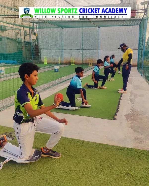 Young bowlers practicing their action while kneeling. This drill isolates the upper body, helping to perfect arm rotation and release without worrying about the run-up.