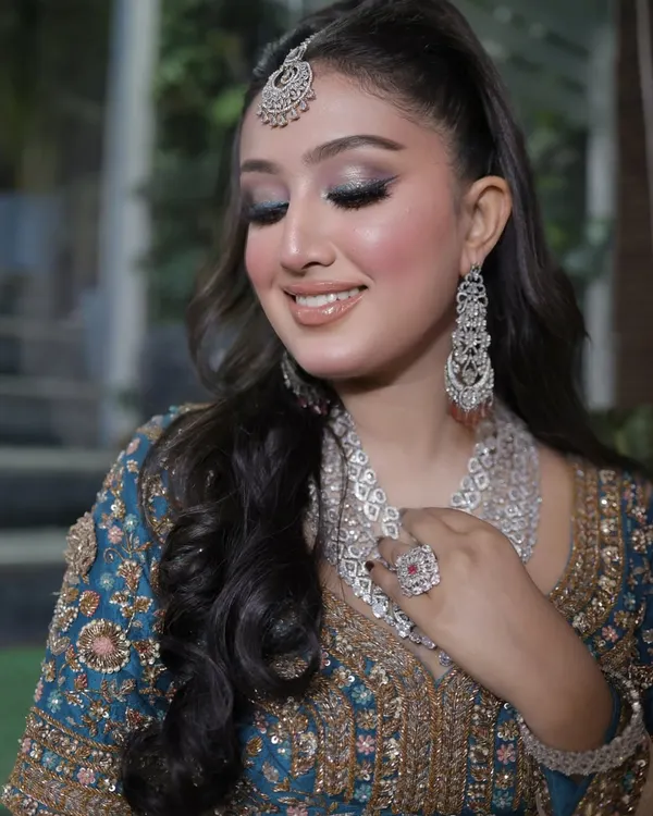 Glowing up with a fresh glam makeup look. This features a stunning silver-blue smokey eye, flawless skin, and a glossy nude lip for a high-impact, glamorous result.