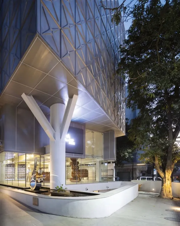This is the Museum of Art & Photography (MAP) in Bangalore, a project that embodies our approach to creating public landmarks. The building's stainless steel-clad structure, inspired by post-industrial water tanks, engages with the city's history while creating a modern, accessible space for art and community.