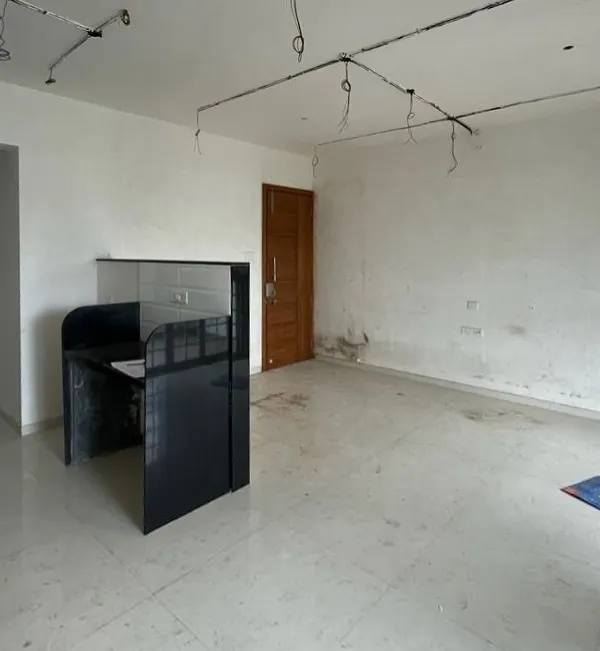 Before: A bare room with exposed wiring. We saw the potential for a vibrant, modern living space.