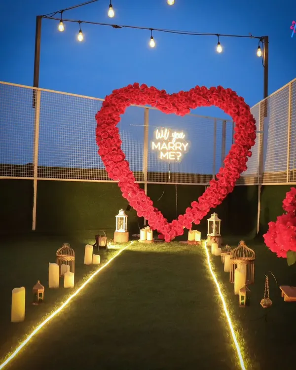 This is our most requested proposal setup, designed for maximum impact. The glowing pathway, lanterns, and massive rose heart create a breathtaking scene for asking the most important question of your life.