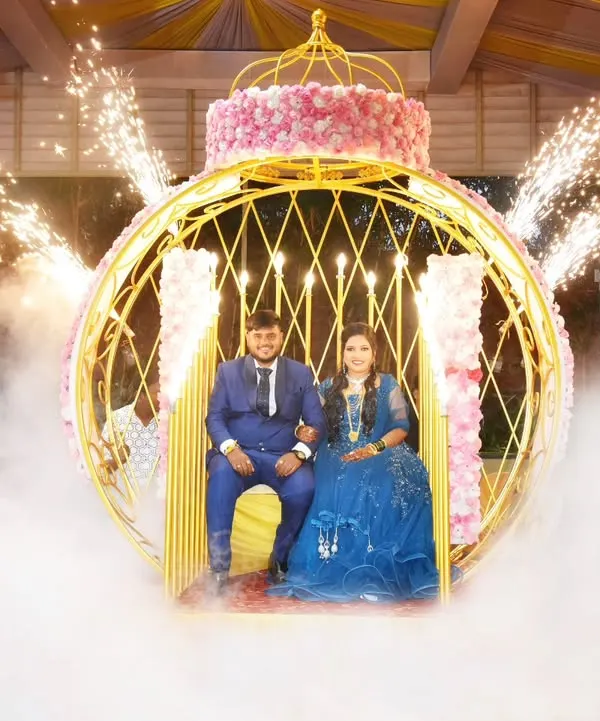 A fairytale entrance for the happy couple, framed by a golden carriage, ethereal smoke, and brilliant cold sparklers. We create these grand, cinematic moments for your reception.