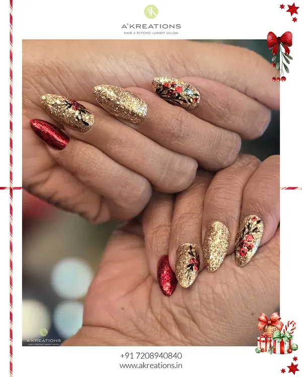 A bold and glamorous Christmas manicure. This set combines full-coverage gold glitter nails with rich red accents and hand-painted festive foliage for a truly celebratory look.